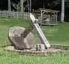 What is it? Set 448  |  2599, either artifact of Fred Flinstone's car, or maybe a millstone for...