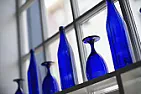 Bottle walls and windows. Where's the red?  |  My wife and I built a raised garden bed with green wine bottles and mortar. Then...