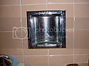 Removing ancient chrome bathroom fixture |  This type of fixture is mortared into the wall opening. Getting it out without...