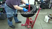 What would you use to hold down a HF tire changer?  |  That would solve the problem of damaging the garage, but it's a lot of work....