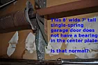 Is a single torsion spring garage door supposed to have a center bearing?  |  What's the construction?  Block garage wall is visible, is the whole...