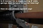 Is a single torsion spring garage door supposed to have a center bearing?  |  Disassembling my first torsion spring setup, on my 8'wide by 7'tall...