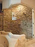Cultured Stone in Shower |  Hi,  I have a master bathroom that is totally black marquina marble(walls,...