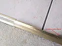 How is this brass strip between floor tiles and carpet fixed down?  | next thread &raquo;