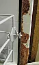 A sign that the dishwasher is malfunctioning and should be replaced?  |  No.  Isn't the thick black line to the left of the rust the rubber gasket...