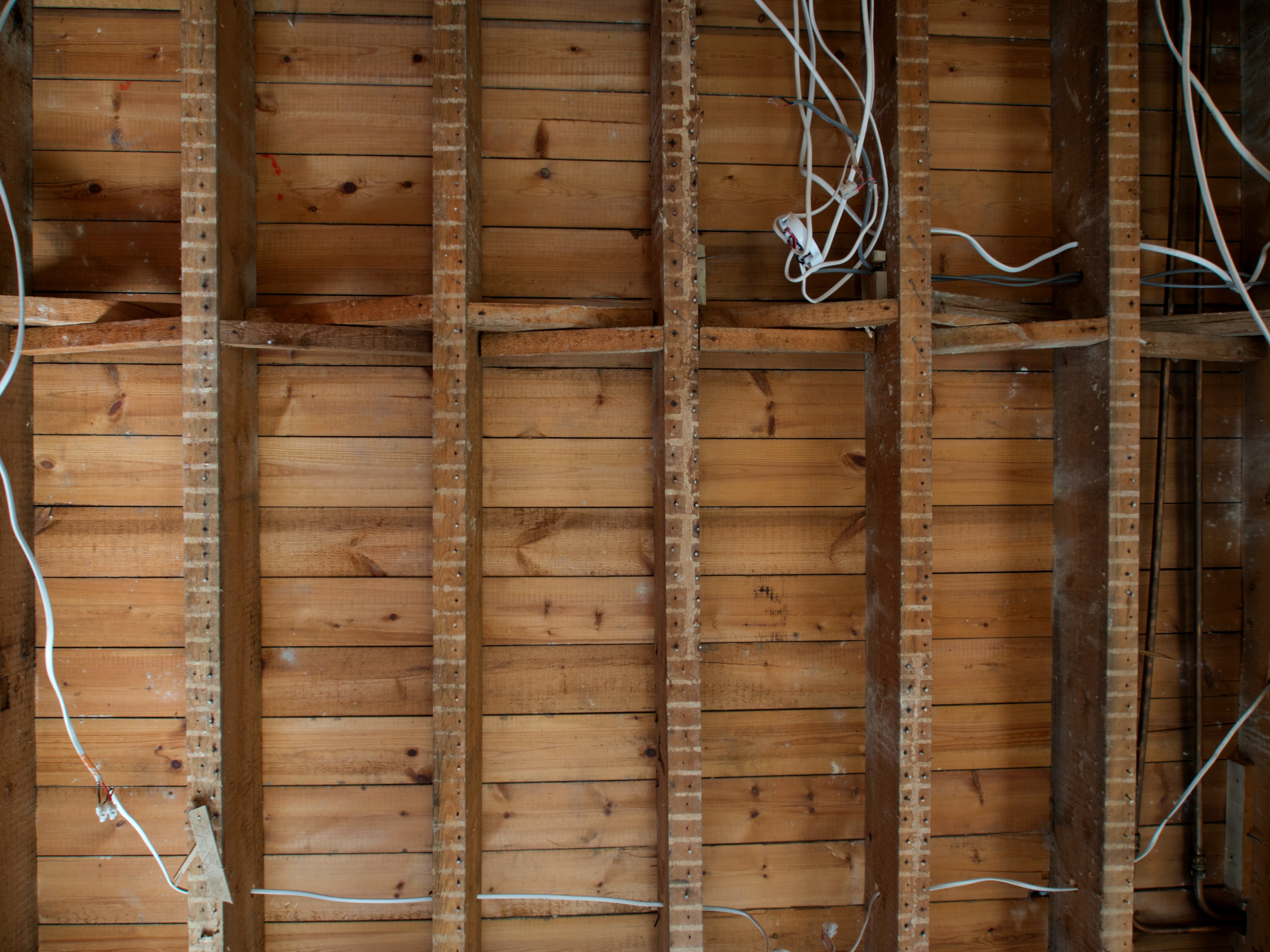 What is the best adhesive for sticking mosquito mesh to a metal grill door?