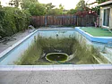 Old swimming pool question |  Close means you drain a portion of your pool and throw a big tarp over it and...