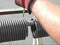 If torsion spring breaks on metal garage door  |  My garage door is an older wooden 9 foot wide. I had one of the coil springs...