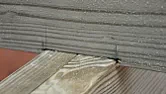 Boring holes through joists  |  I want to run two pipes along under our landing floor (which means going through...