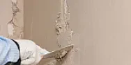 plaster restoration |  I am removing wallpaper in an 80 year old house. Underneath thewallpaper is...