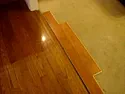 Advice on laminate/hardwood flooring |  I have solid hardwood Bruce flooring in my dinning room/kitchen. Itwas laid...